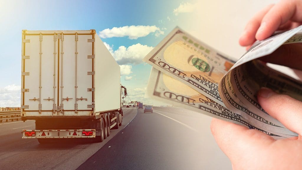 Truck on highway with money in hand