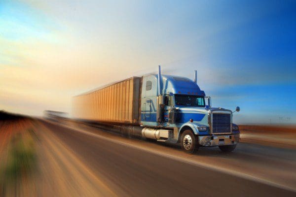 Fast-moving truck on open road