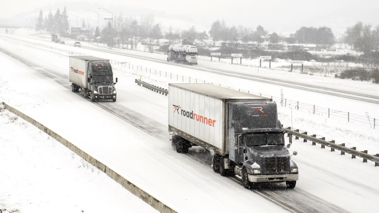 Winter highway traffic with trucks