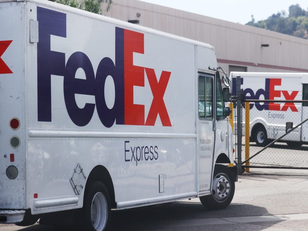 FedEx Express truck at warehouse entrance