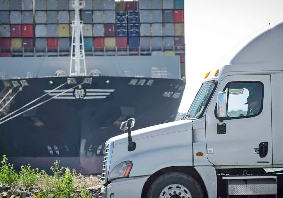Logistics scene with truck and ship