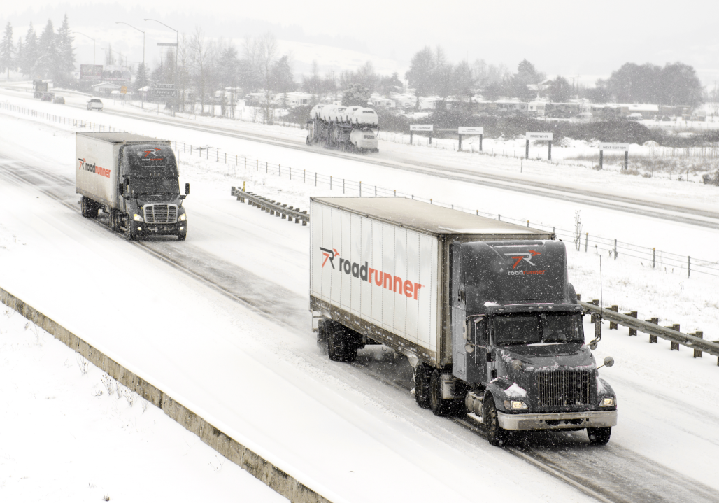 Winter highway traffic with trucks