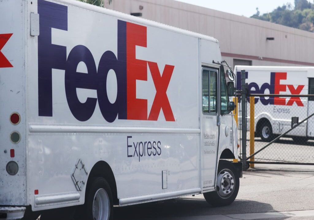 FedEx Express truck at warehouse entrance